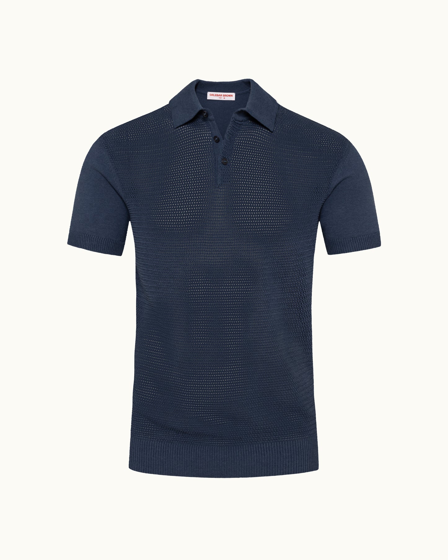 Navy knitted polo shirt on a plain background
