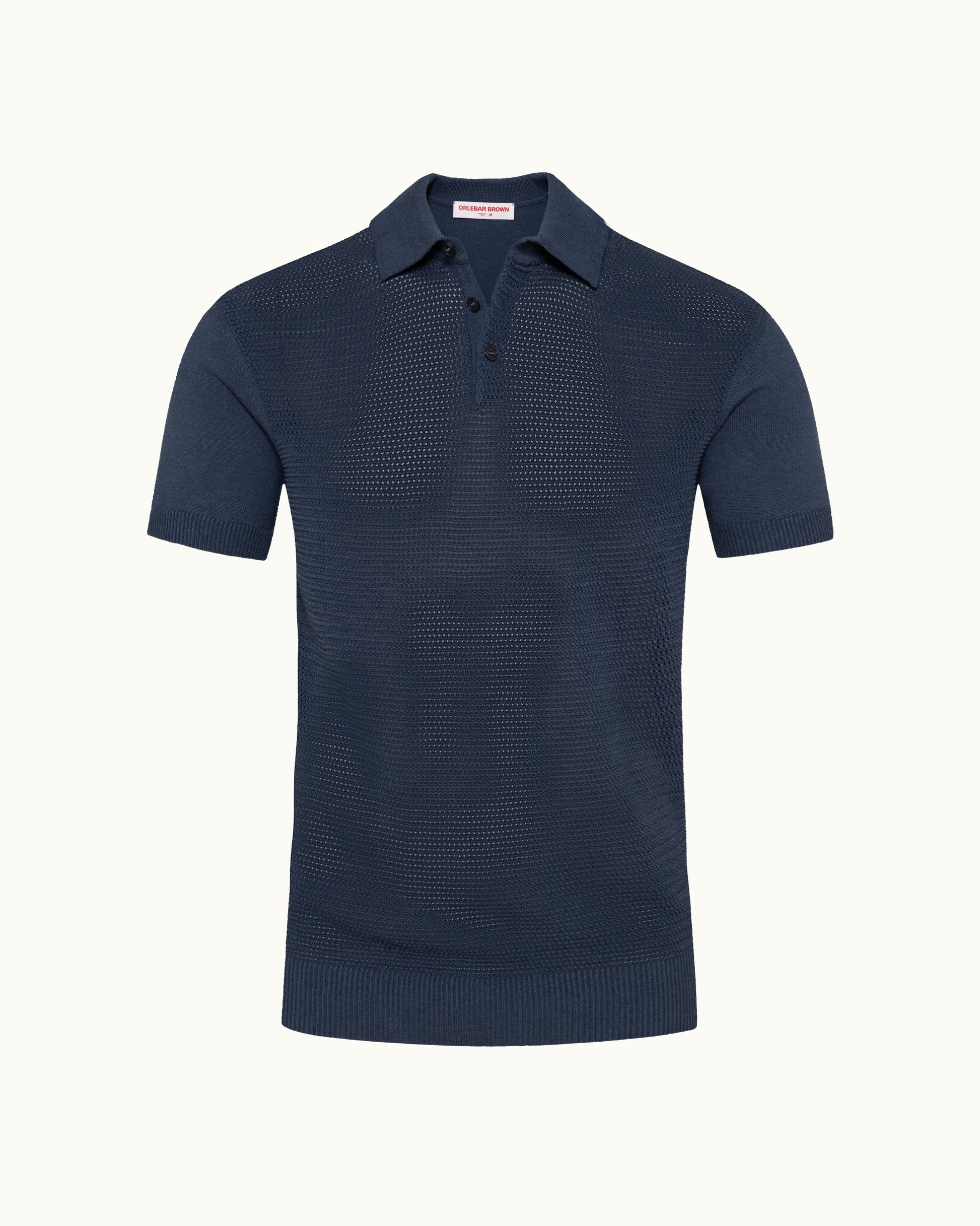 Navy knitted polo shirt on a plain background