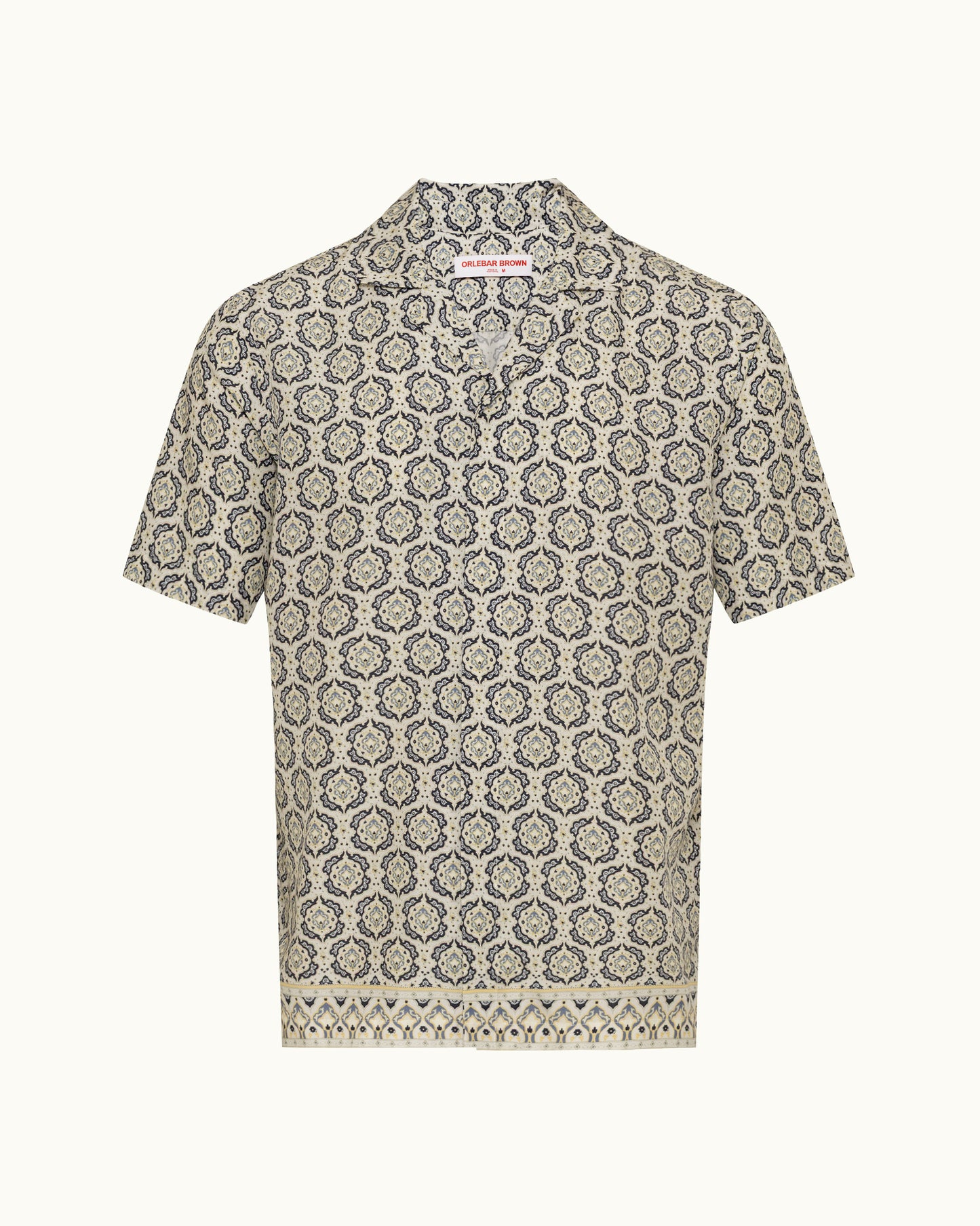 Printed beige shirt on a plain background 