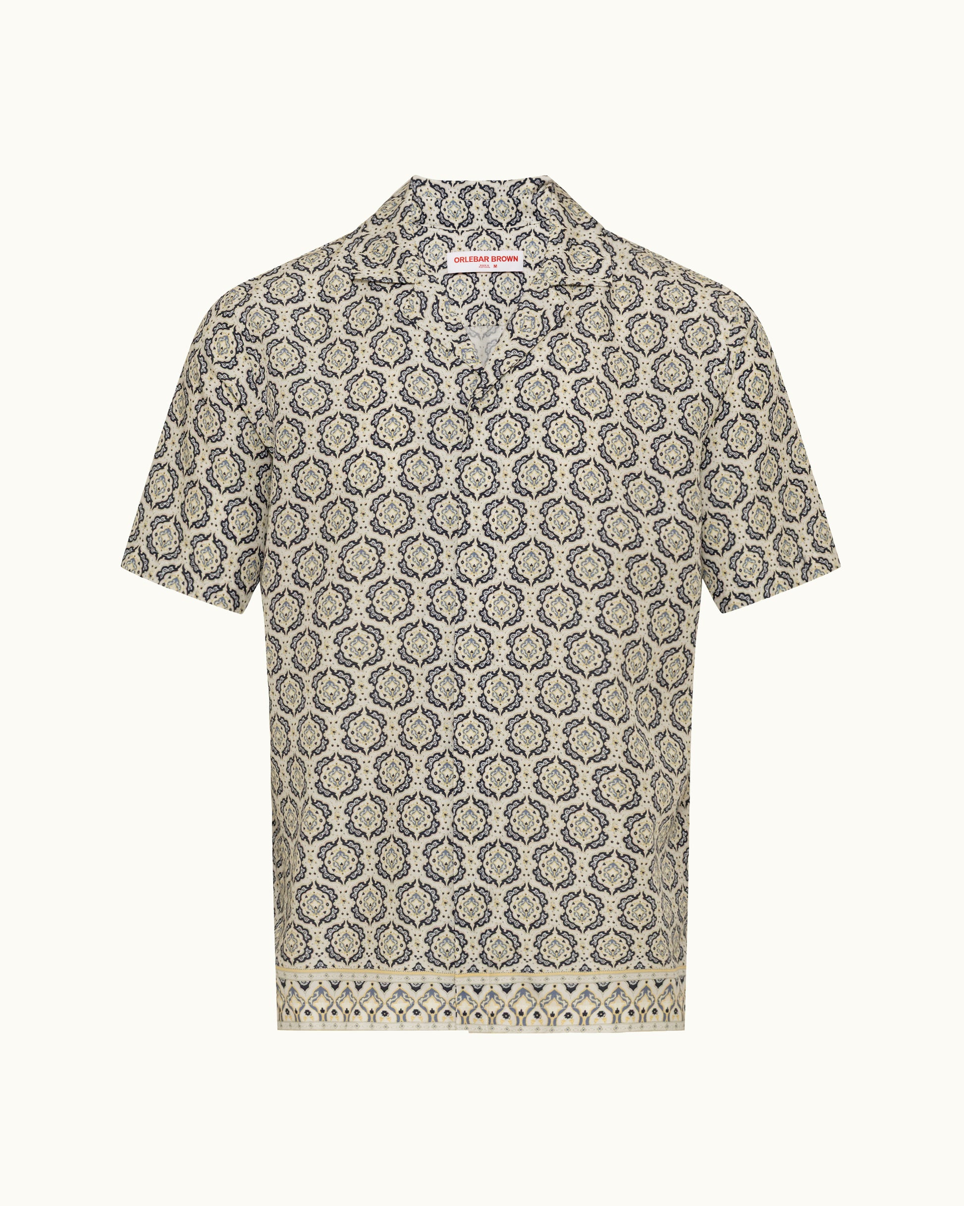 Printed beige shirt on a plain background 