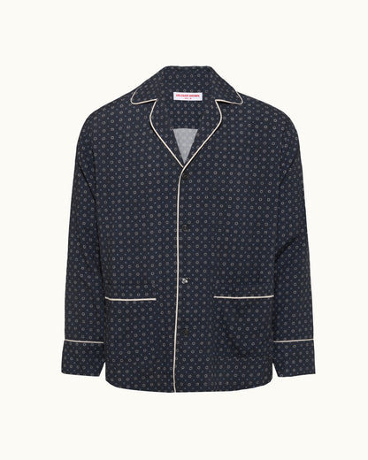 Navy blue jacket with white geo pattern and piping on a white background