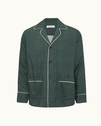Green patterned jacket with white piping on a white background