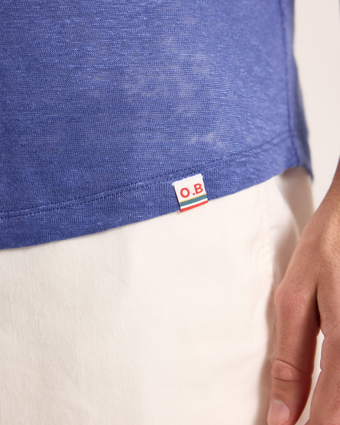 Blue shirt with a brand logo on a white background