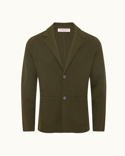 Dark green knitted blazer on a plain background