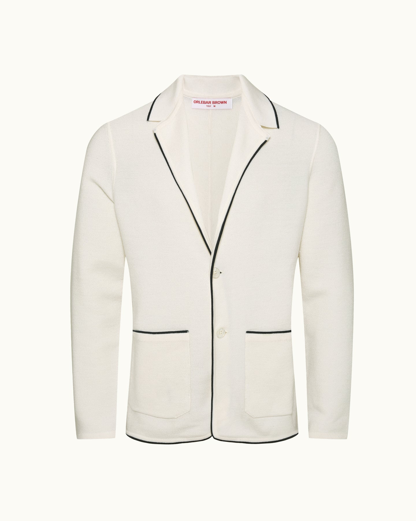 White blazer with black piping on a white background
