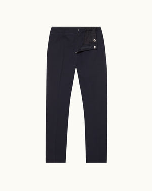 Navy seersucker trousers on a plain background