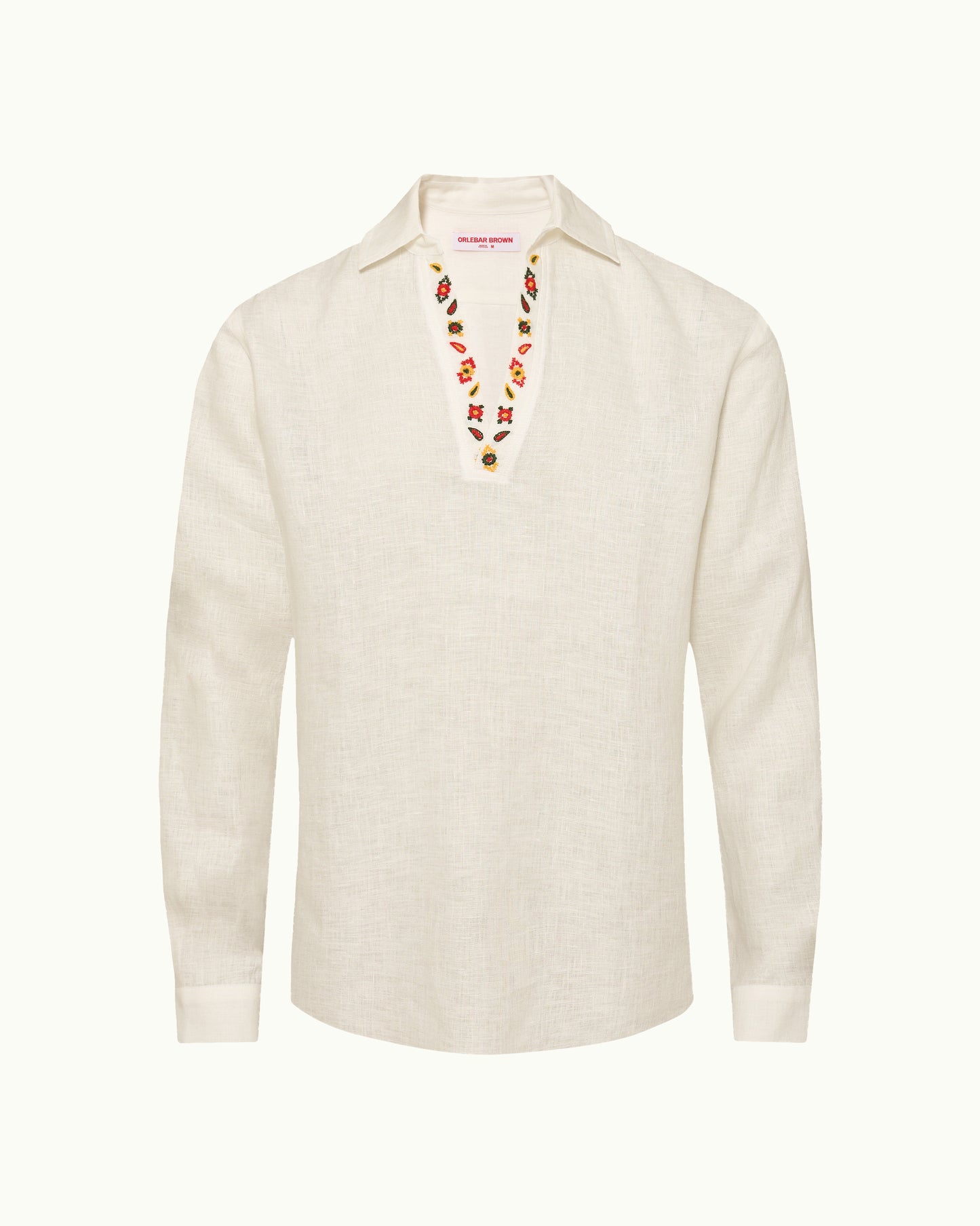 White shirt with embroidered details on a white background
