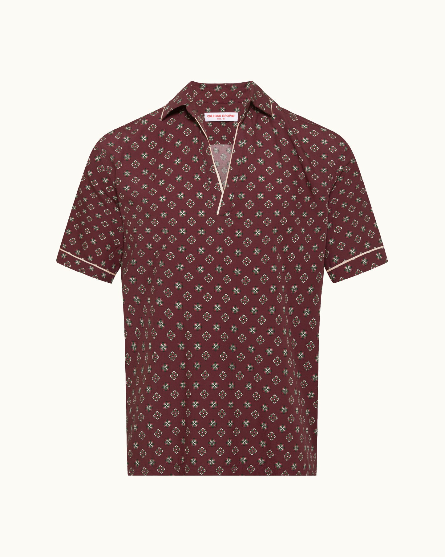 Maroon patterned polo shirt on a white background