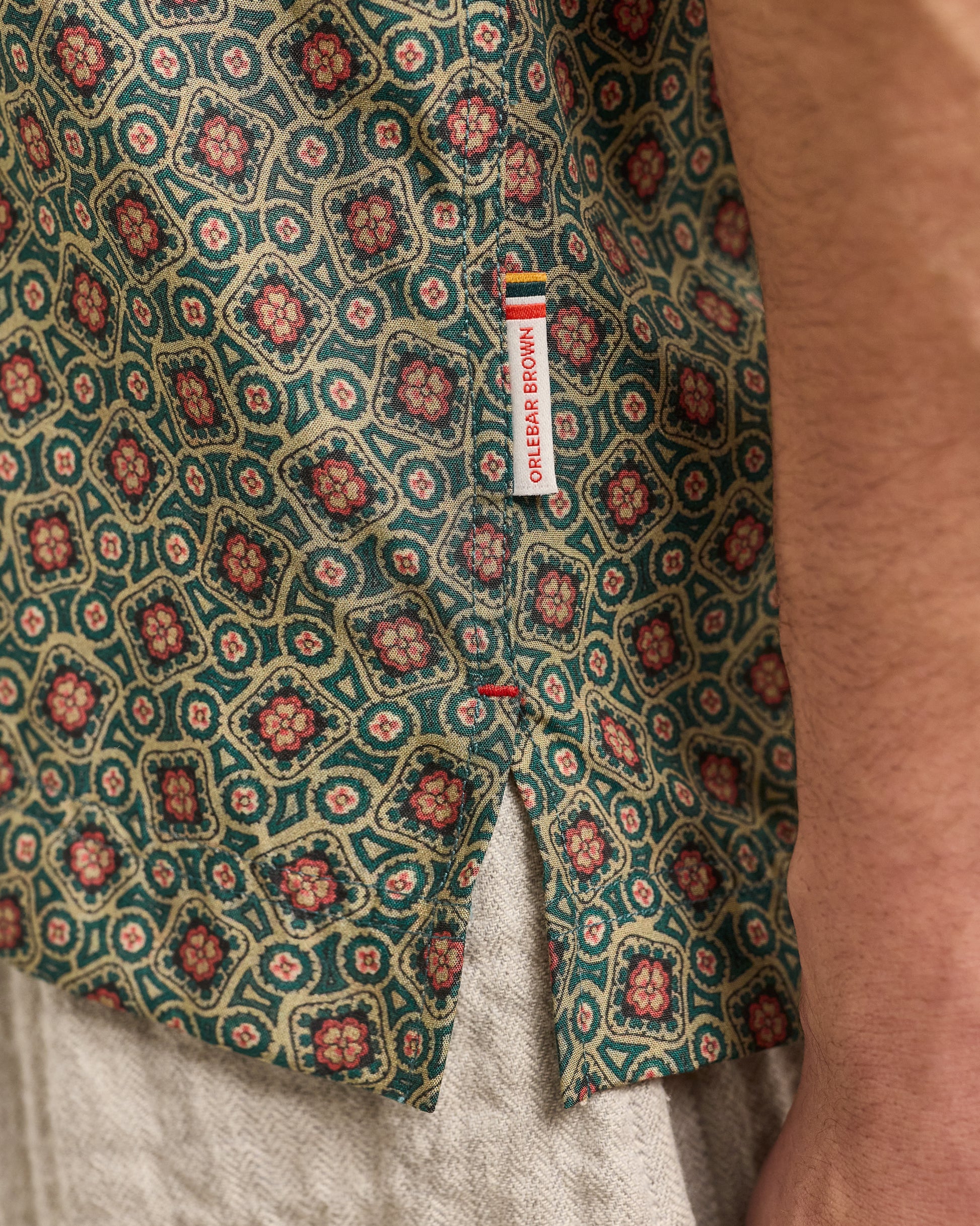 Close-up of a patterned fabric with a visible brand label.