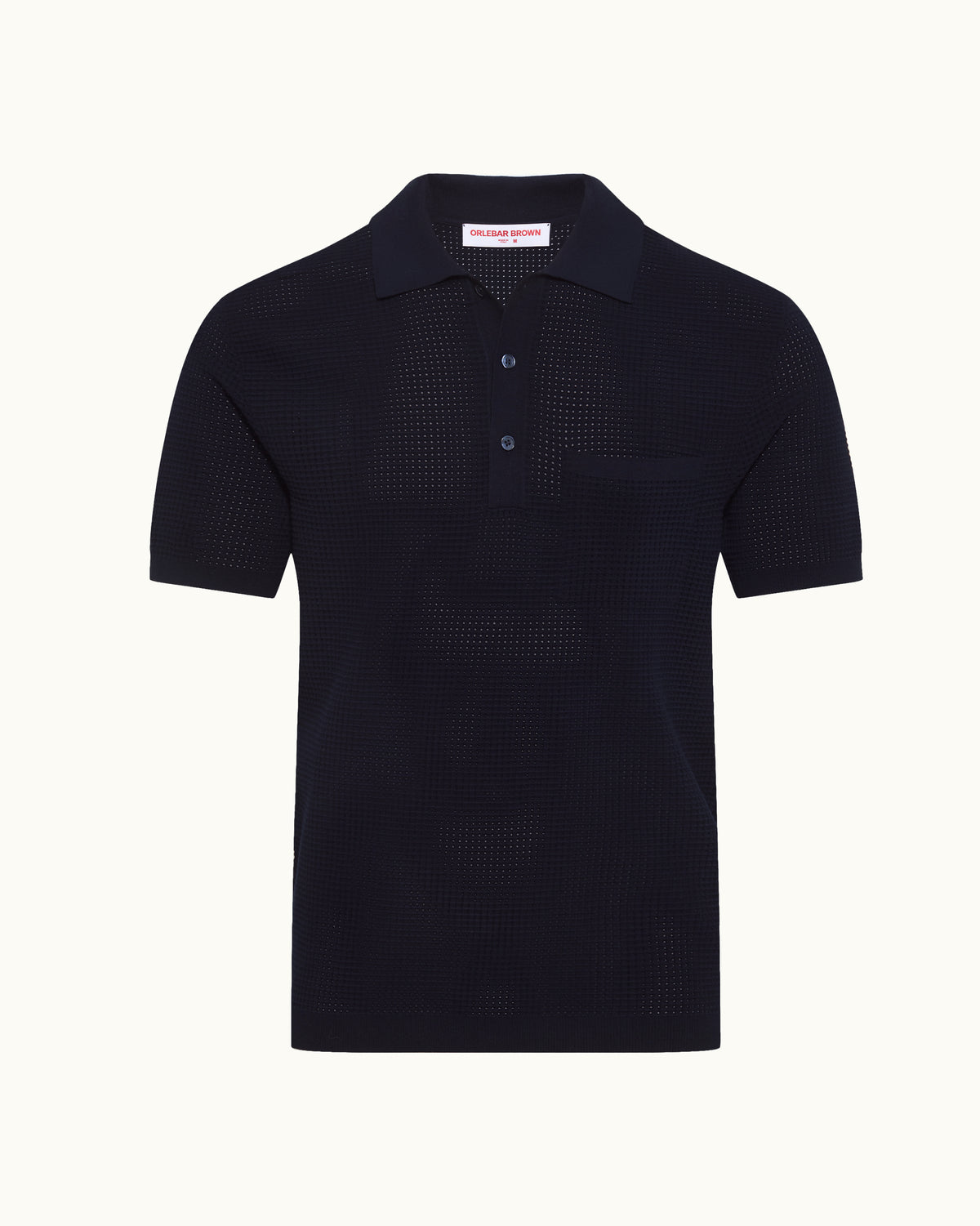 Navy polo shirt in mesh stitch on a plain background