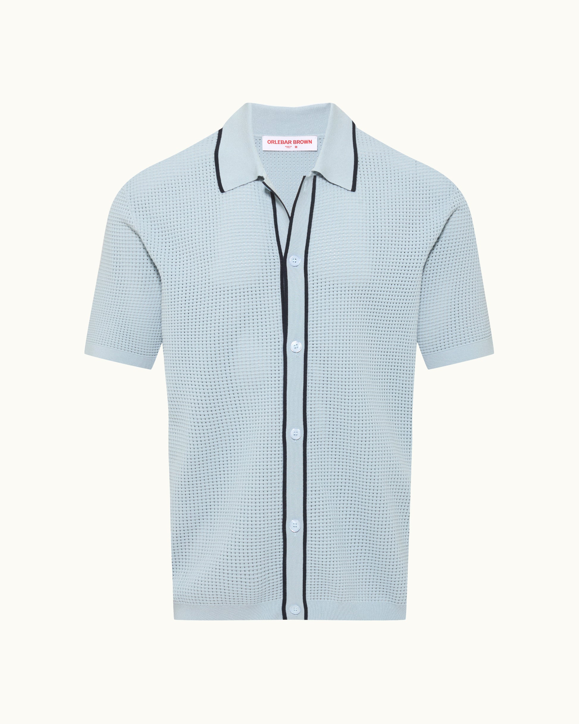 Light blue checkered shirt with black trim on a white background