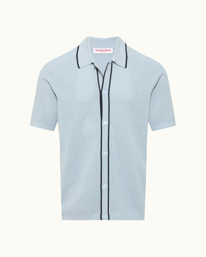 Light blue checkered shirt with black trim on a white background