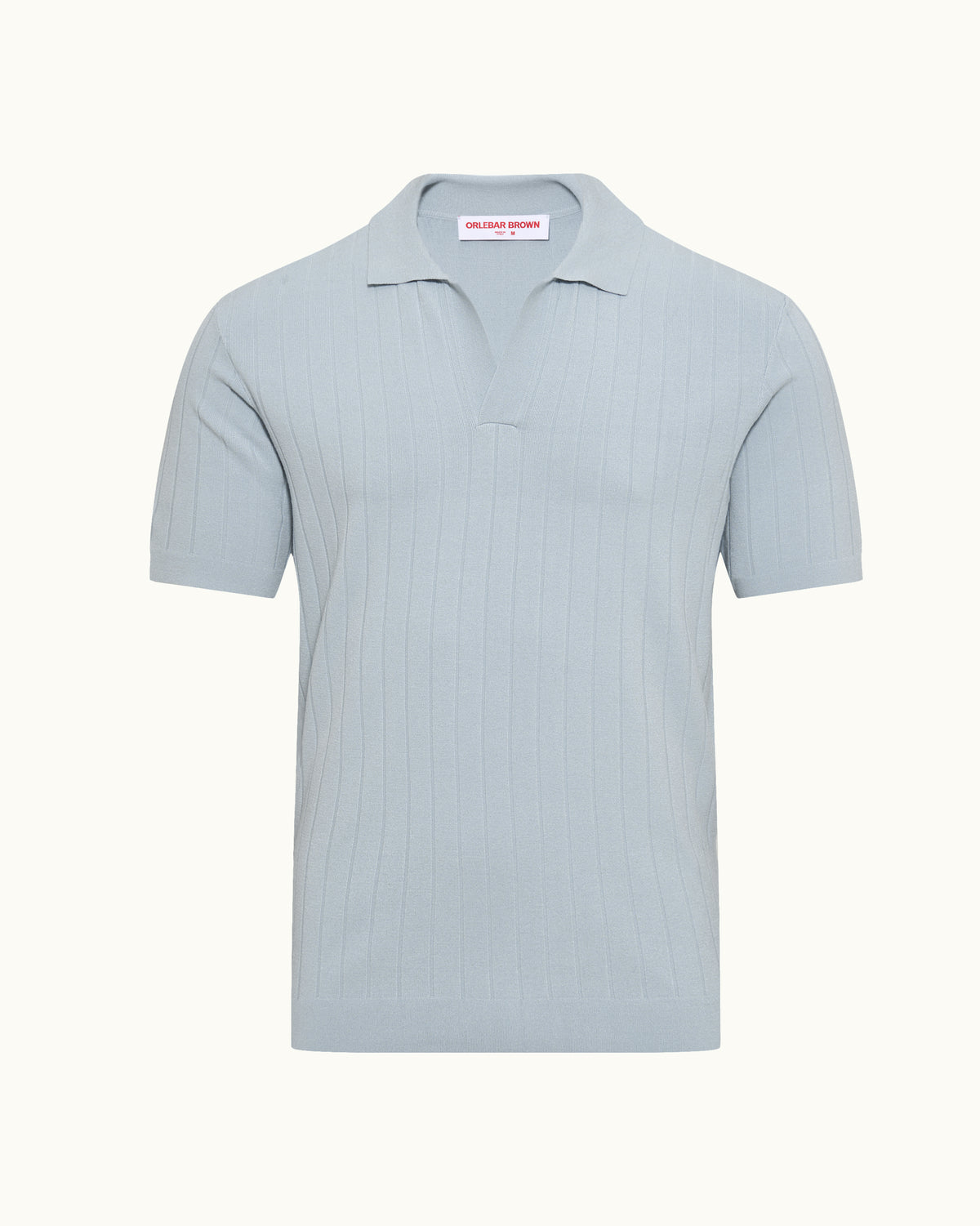 Light blue wide ribbed polo shirt on a plain background