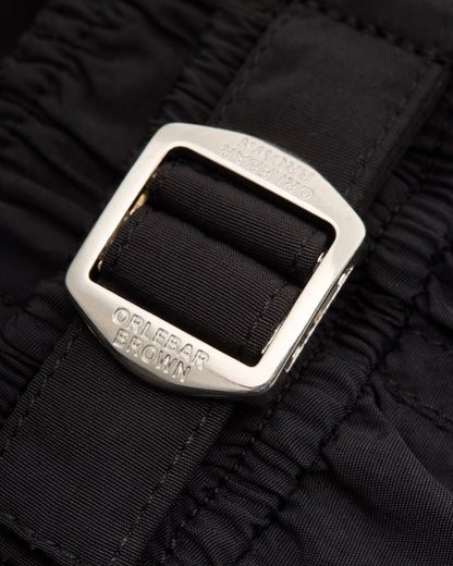 Closeup of of silver buckle on black background