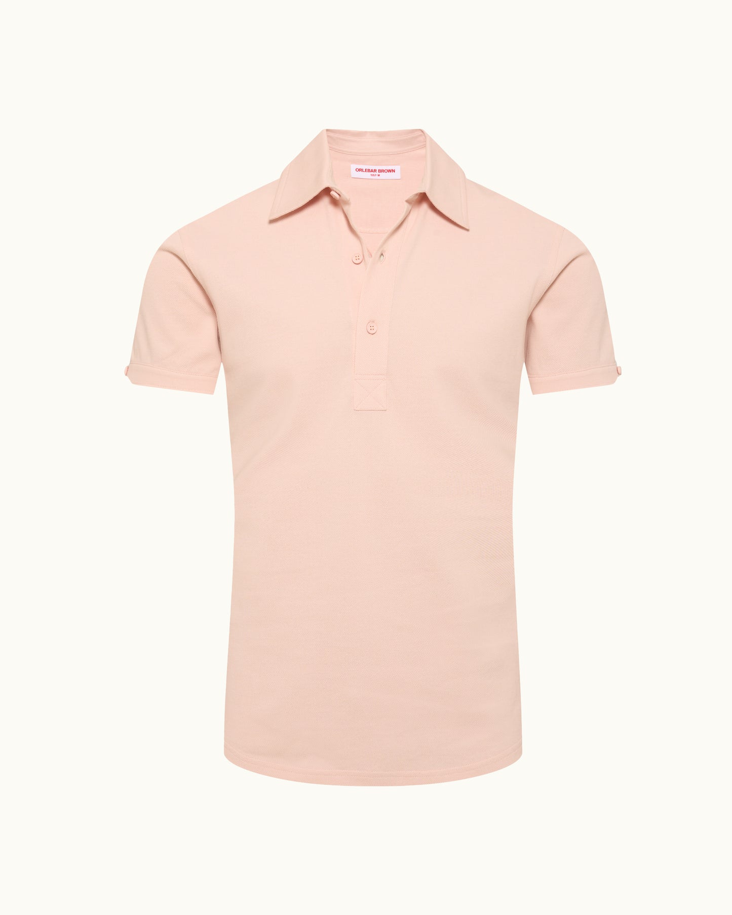 Pink polo shirt on a plain background