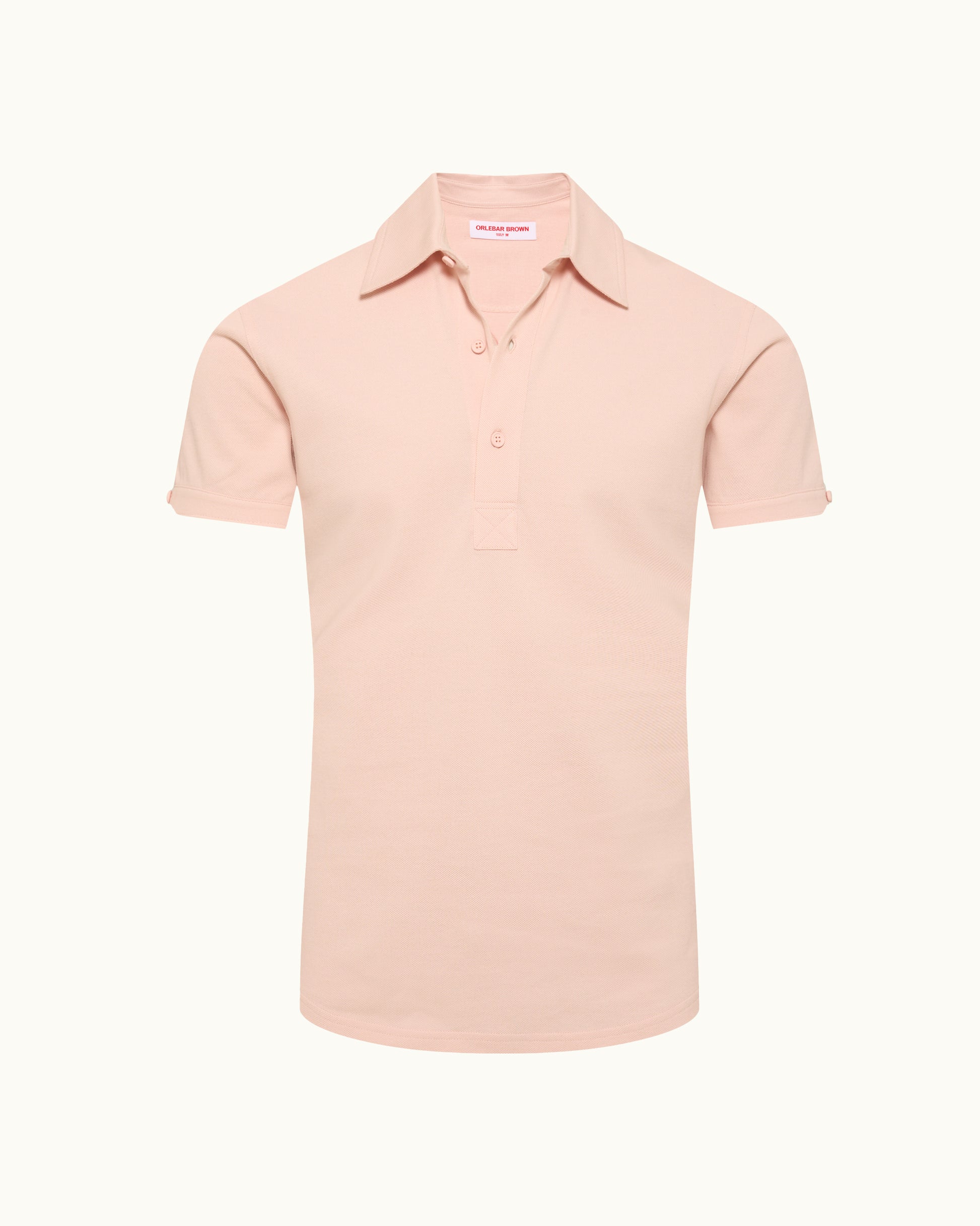 Pink polo shirt on a plain background