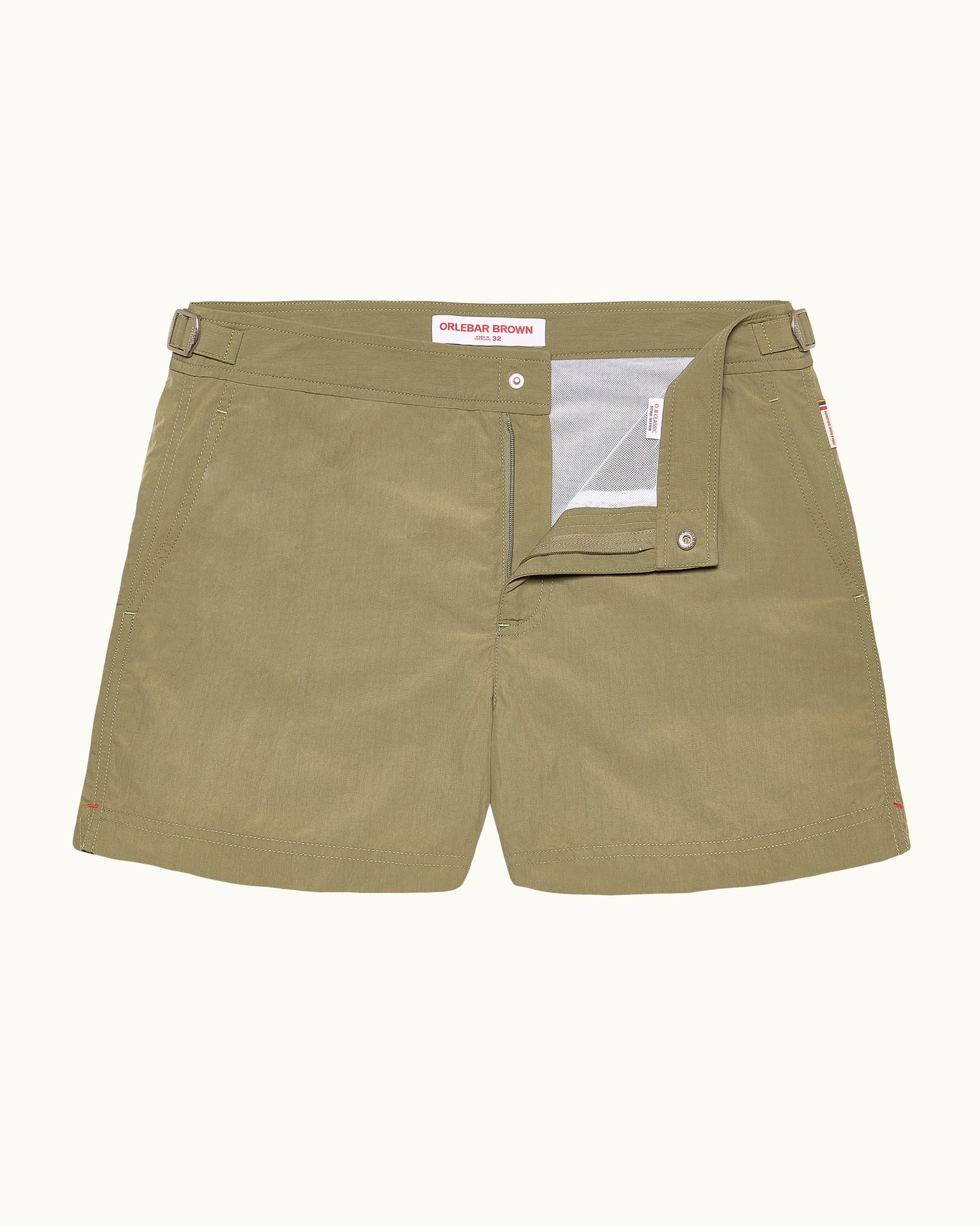 Olive green shorts with a brand label on a white background