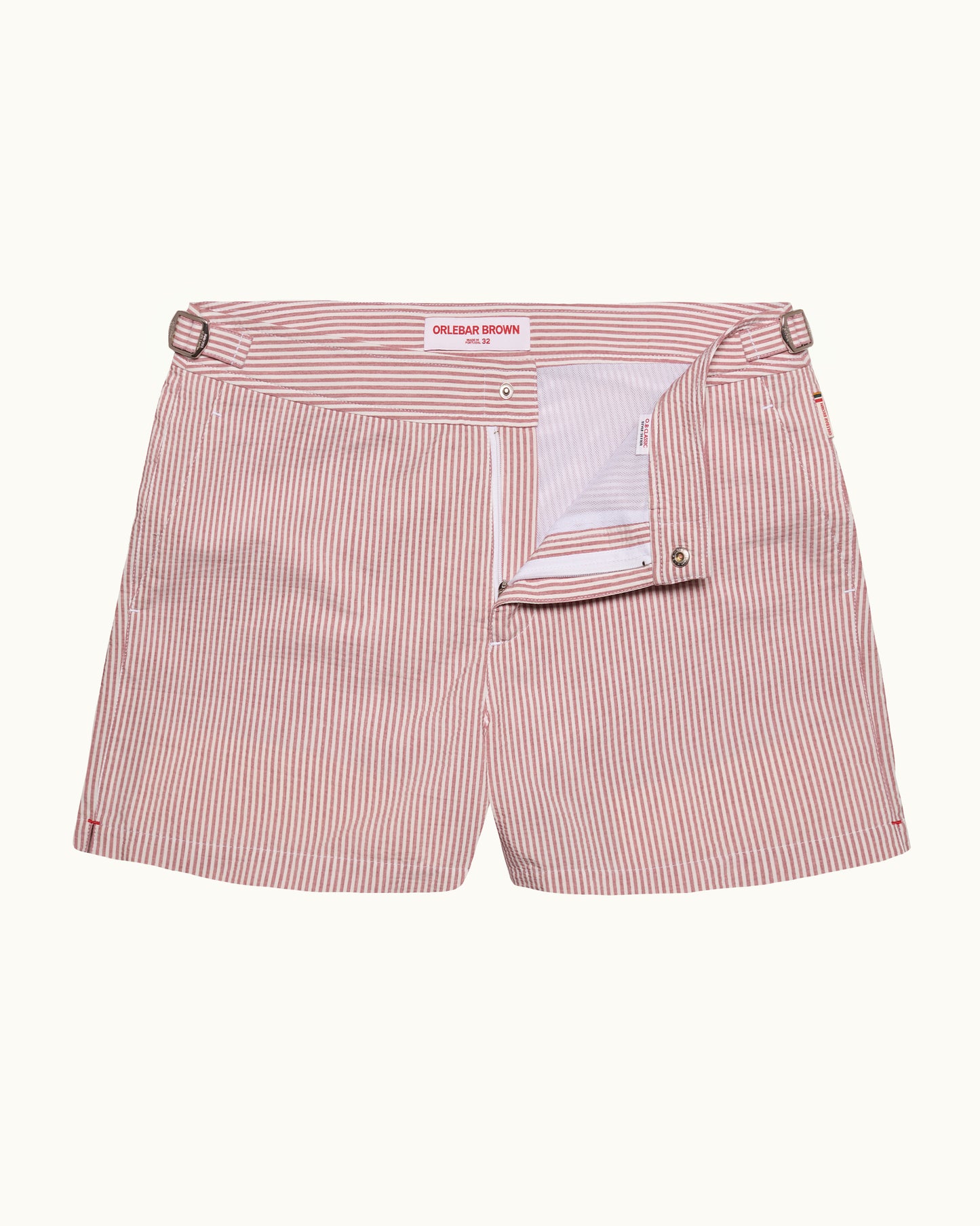 Pink striped shorts with a belt on a white background