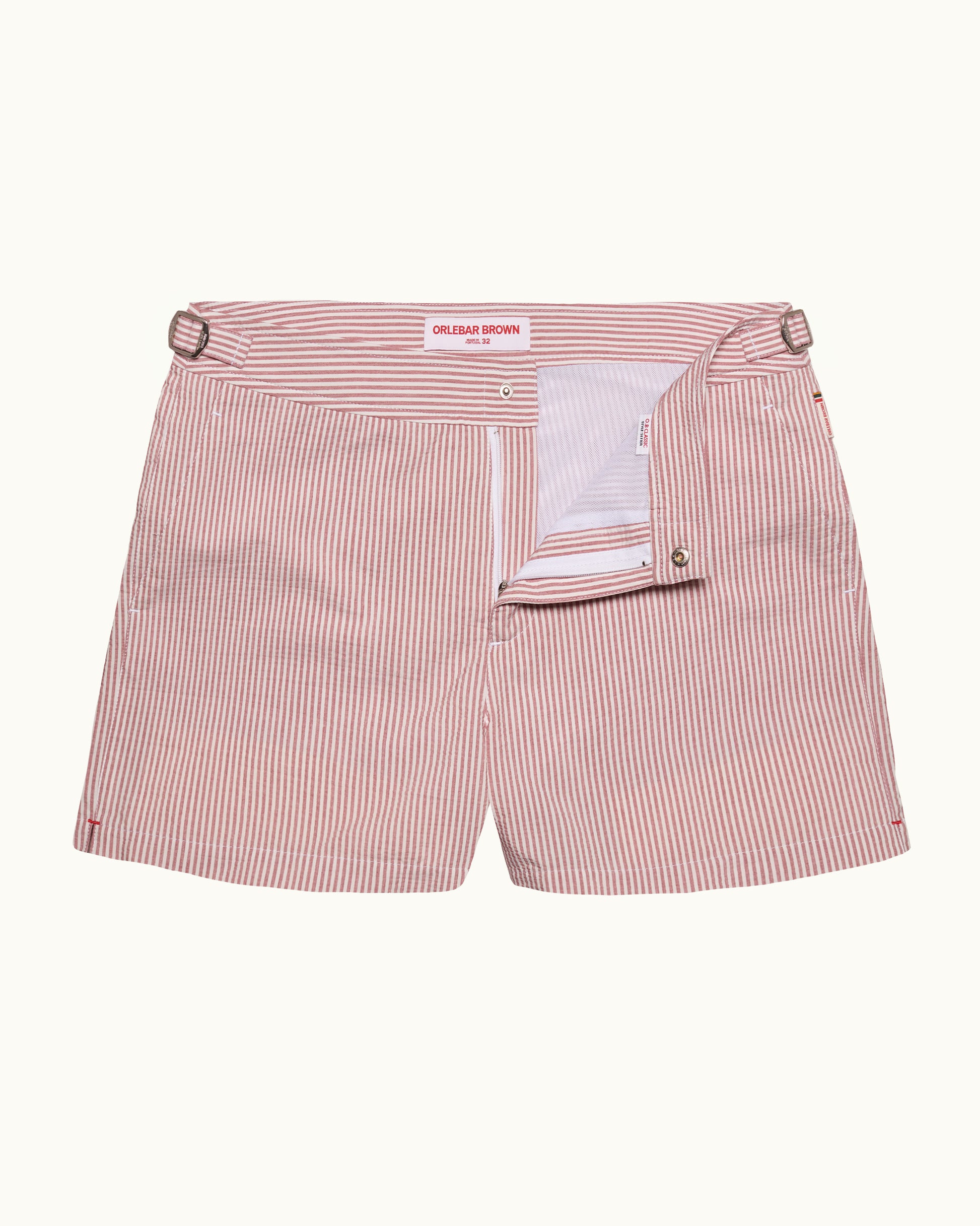 Pink striped shorts with a belt on a white background