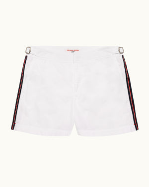 White shorts with red and black side stripes on a white background