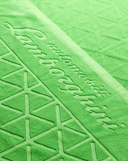 Close-up of a green textured surface with embossed text