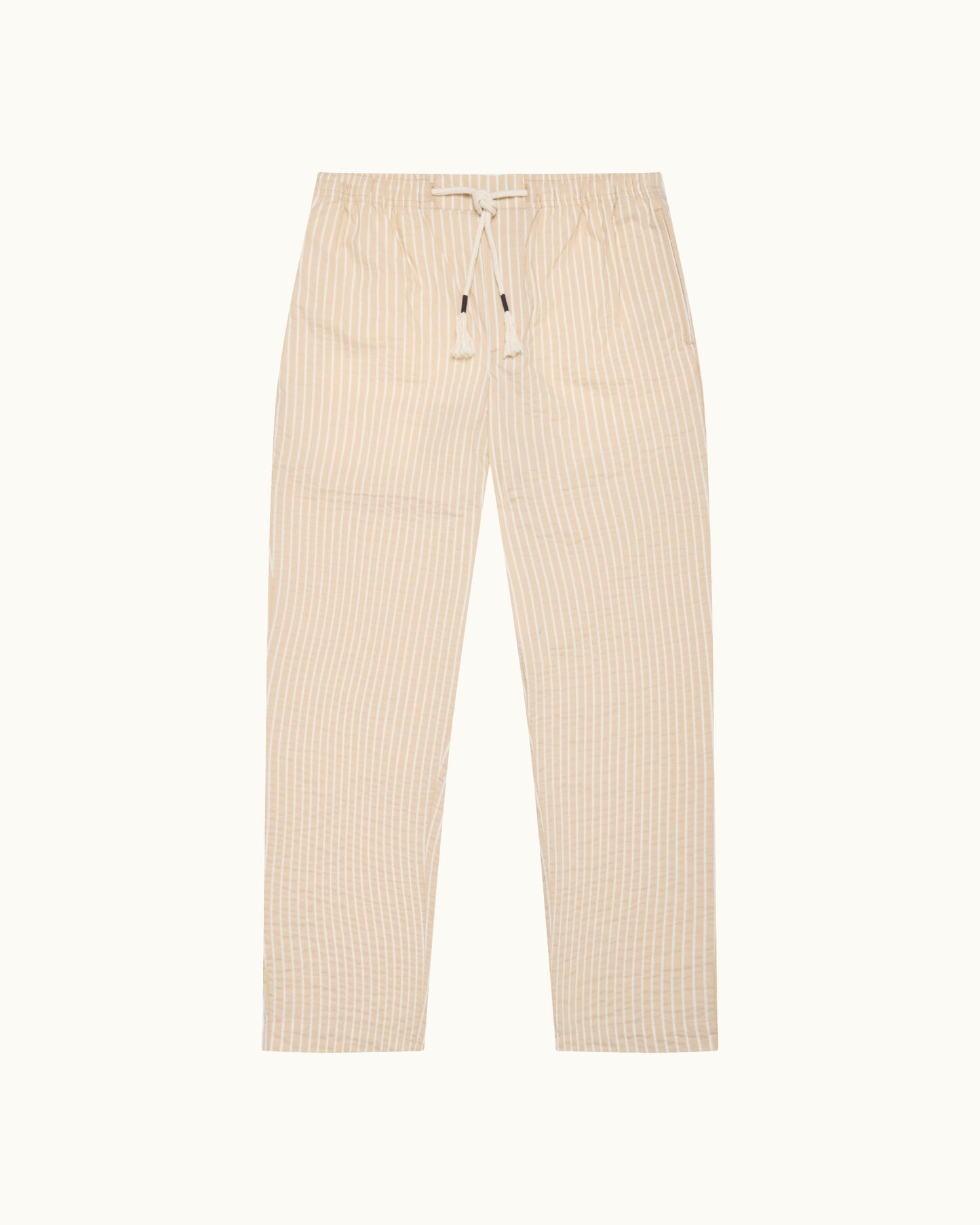 Light beige trousers with drawstring waist and subtle stripes on a light background