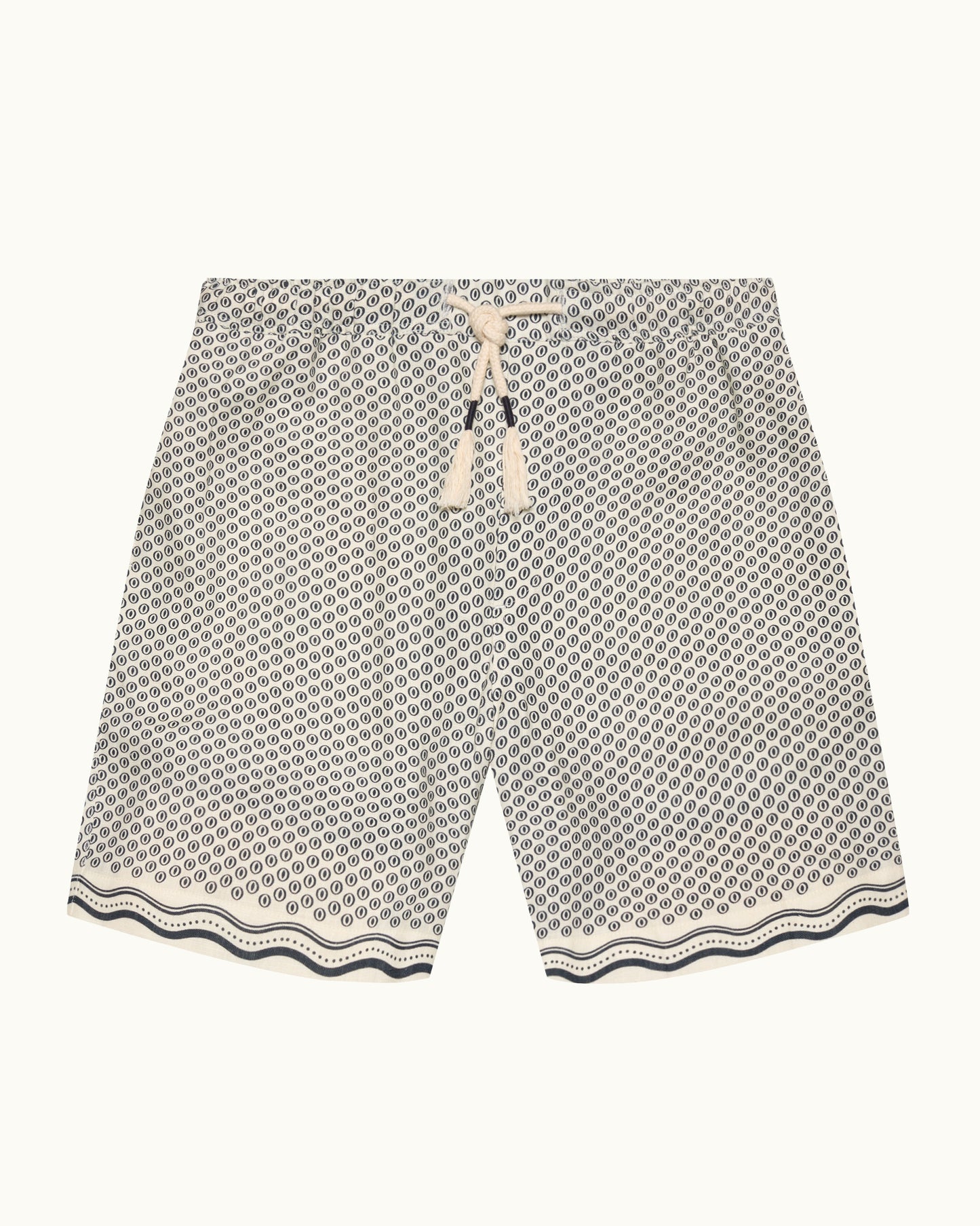 A pair of men's casual shorts featuring a black and white geometric honeycomb pattern, a cream-colored drawstring waist, and a wavy patterned hem, displayed flat against a light off-white background.