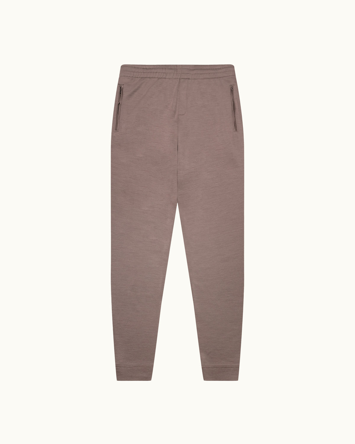 A pair of heathered taupe-brown jogger pants with zippered side pockets, against a white background.