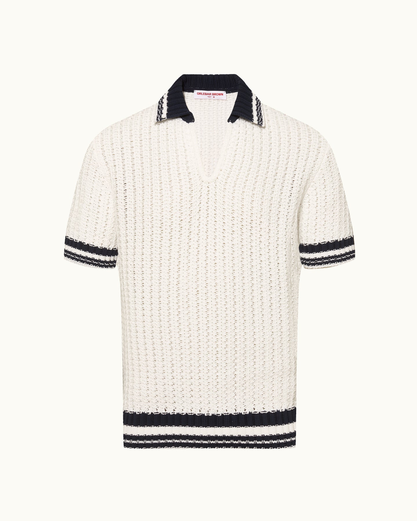 White knitted polo shirt with black trim on a white background