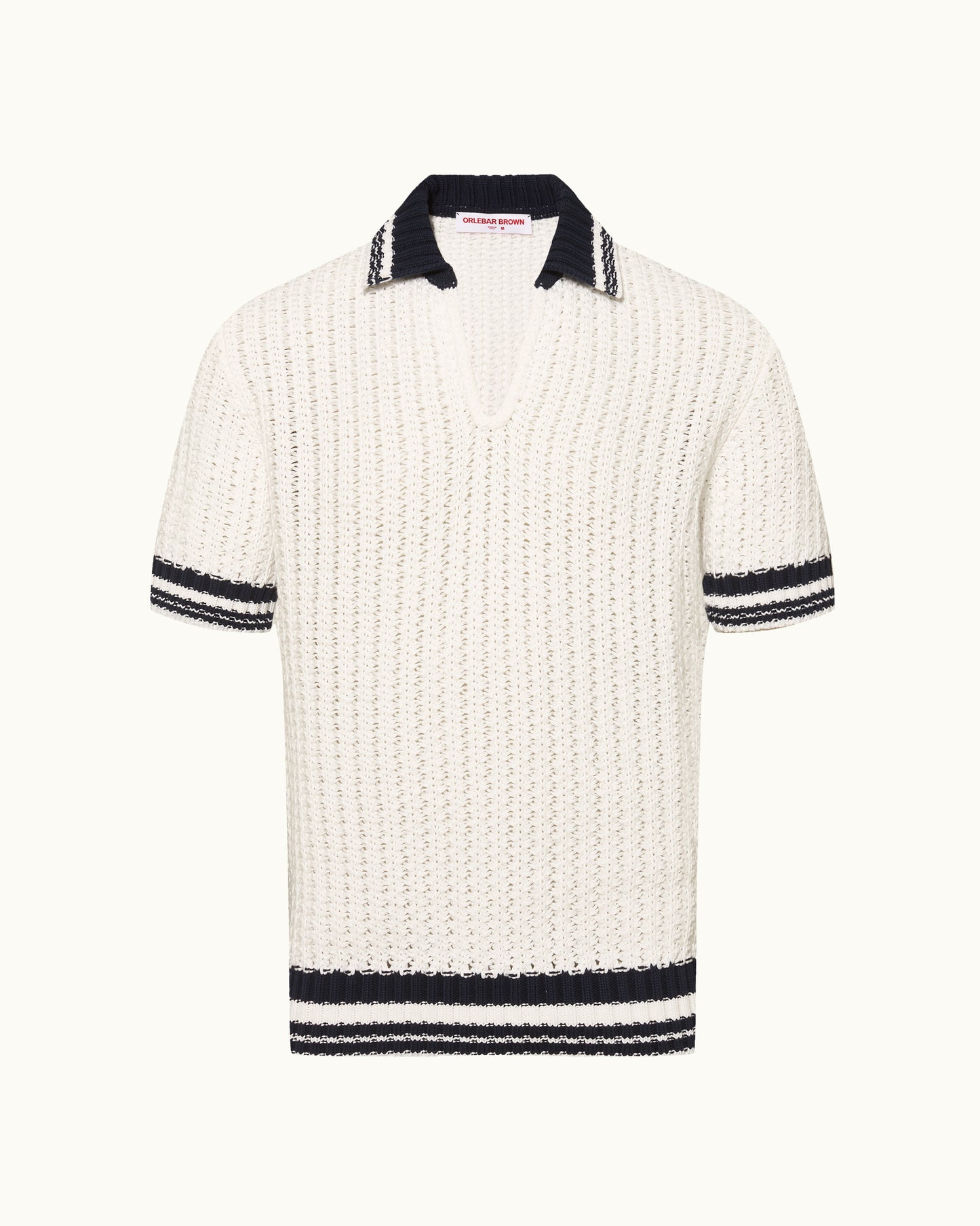 White knitted polo shirt with black trim on a white background