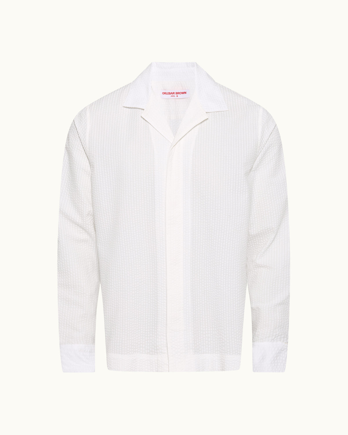 White long sleeve shirt with revere collar on a plain background