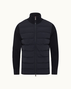 Black puffer jacket on a white background