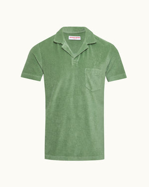 Green polo shirt on a white background