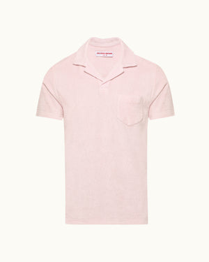 Pink polo shirt on a white background
