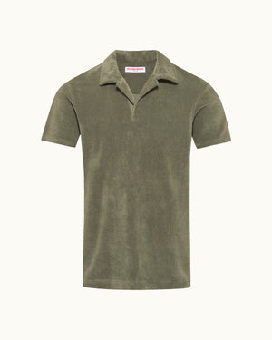 Green polo shirt on a white background