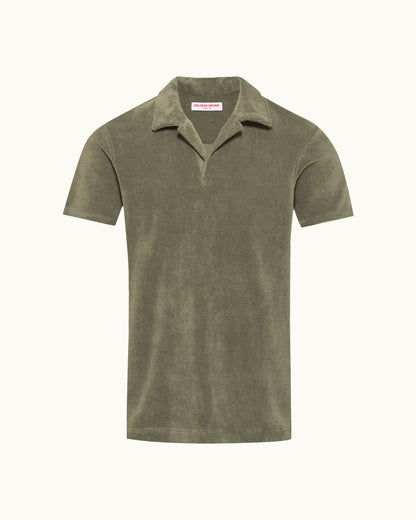 Green polo shirt on a white background