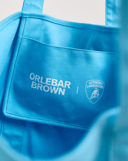Blue bag with 'Orlebar Brown' and 'Automobili Lamborghini' logos.