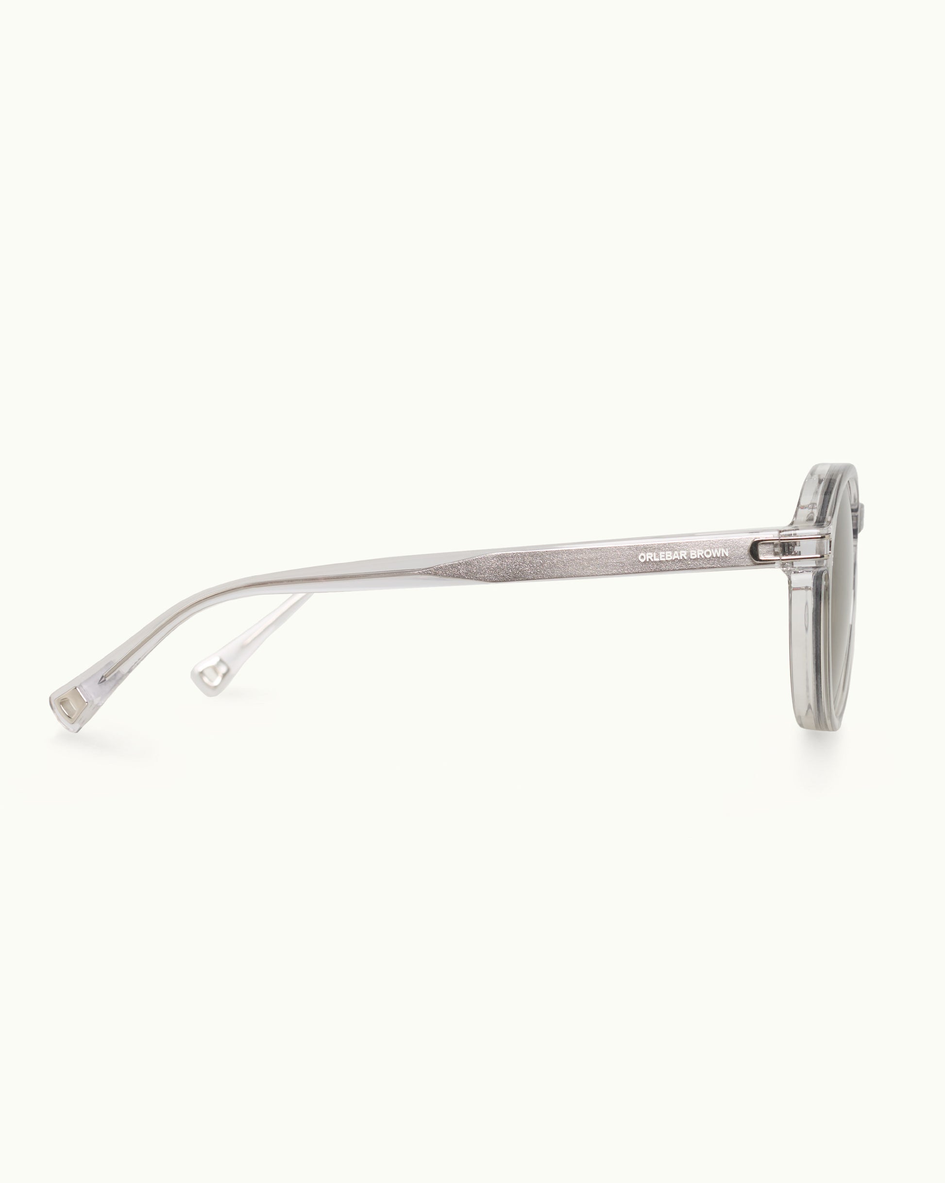 Silver sunglasses with a thin frame on a white background