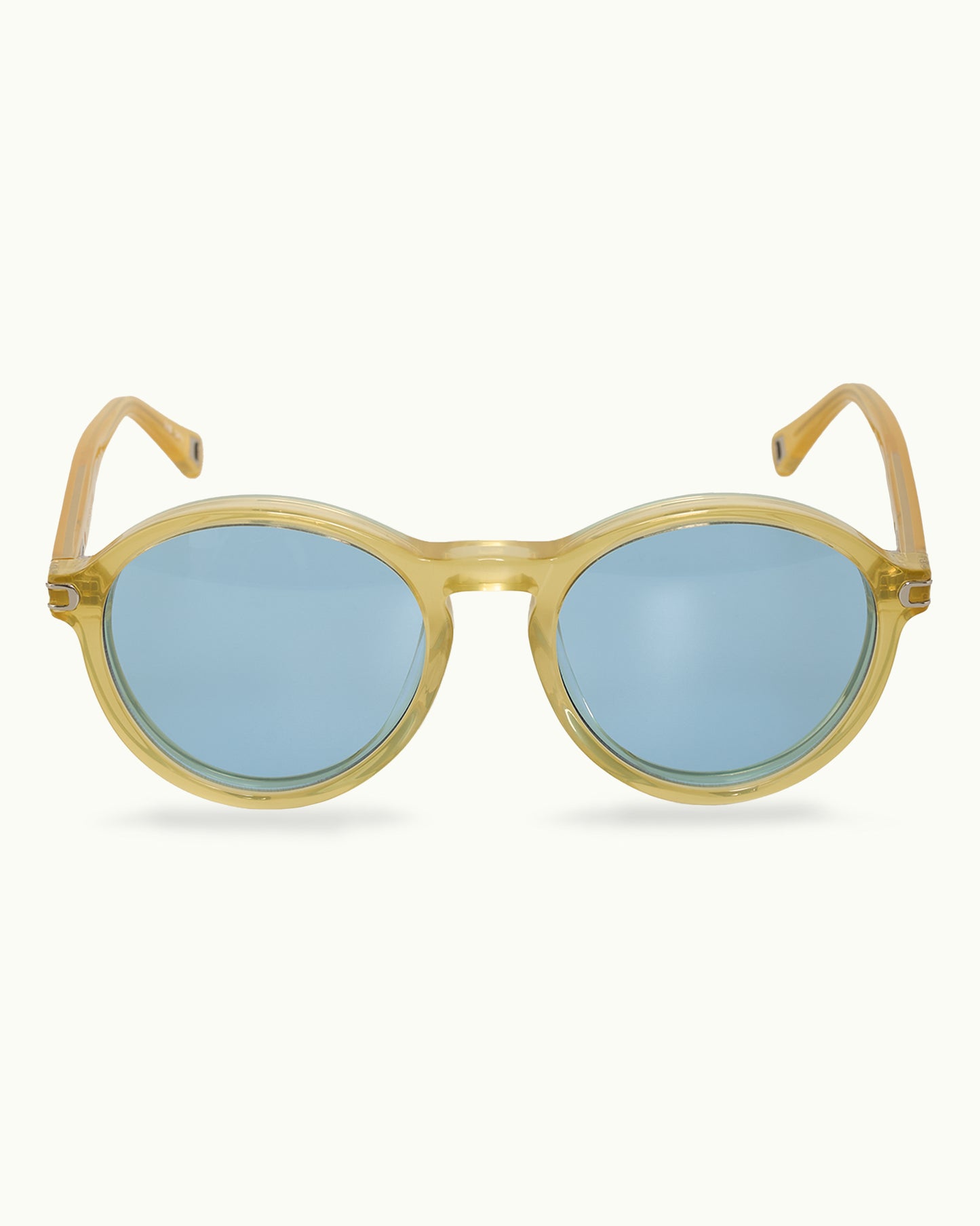 Round sunglasses with gold frame and blue lenses on a white background