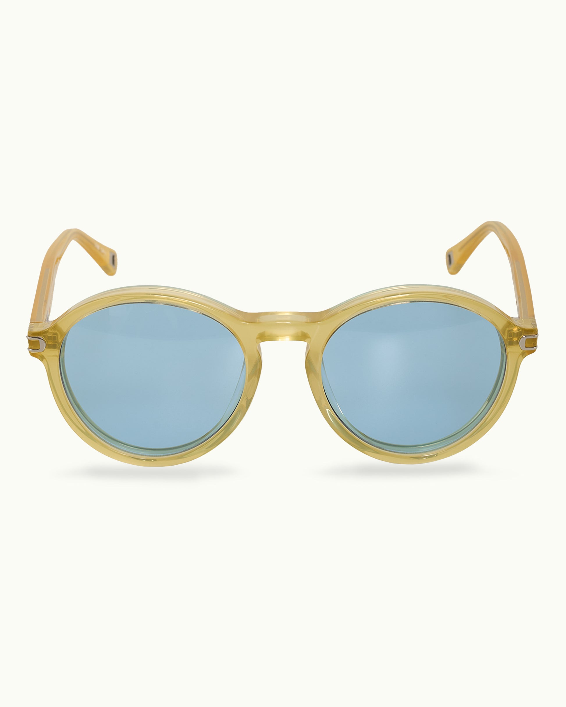 Round sunglasses with gold frame and blue lenses on a white background