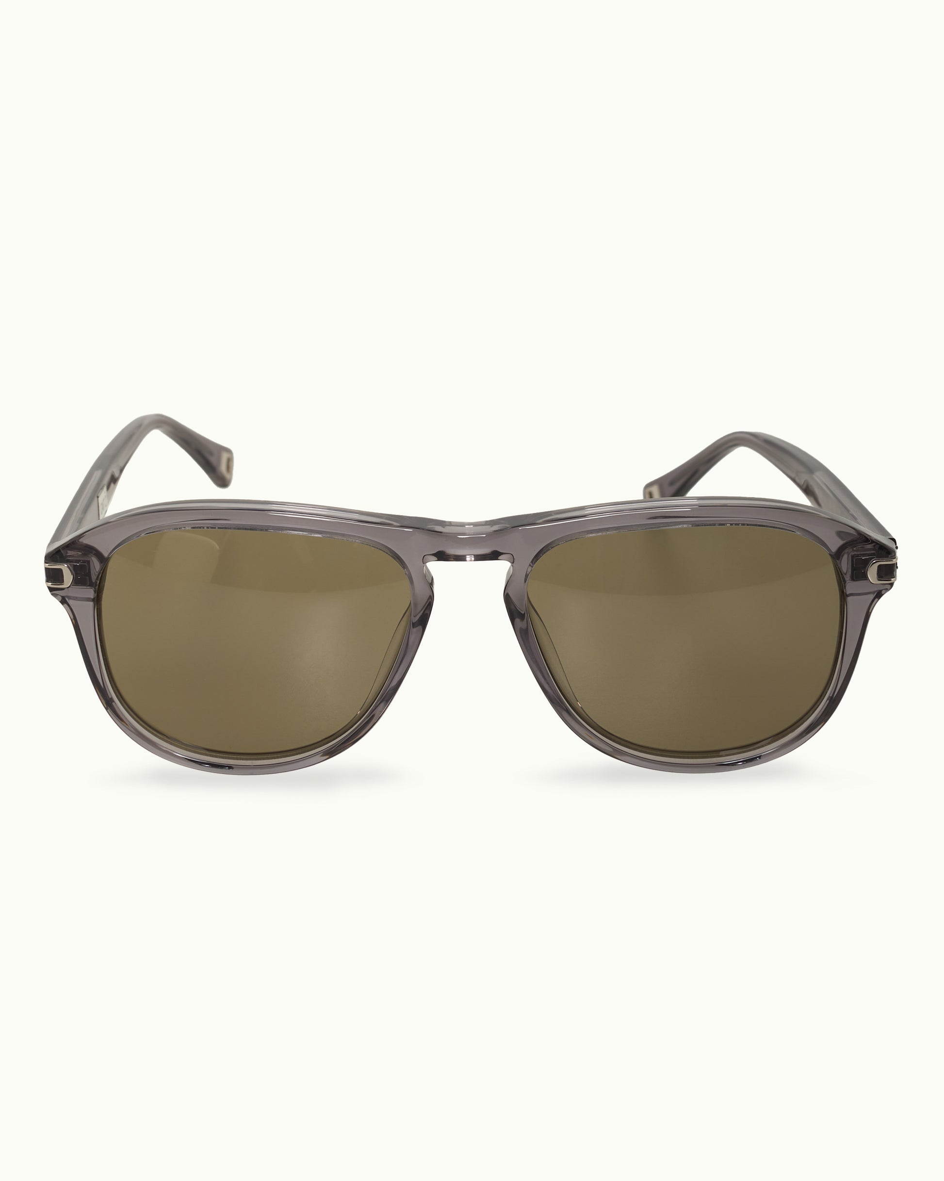 Sunglasses with a transparent frame and dark lenses on a white background