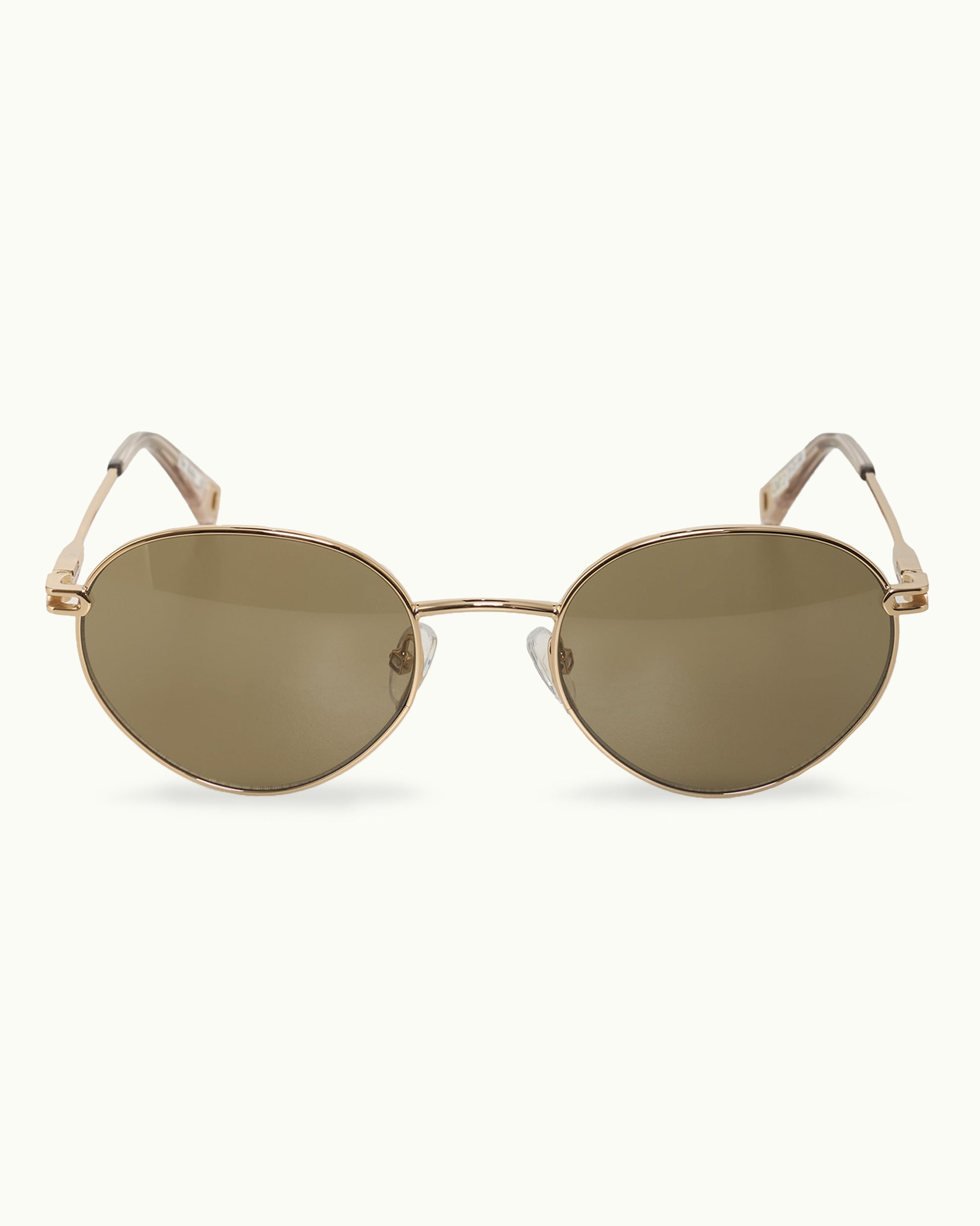 Gold-framed sunglasses with reflective lenses on a white background