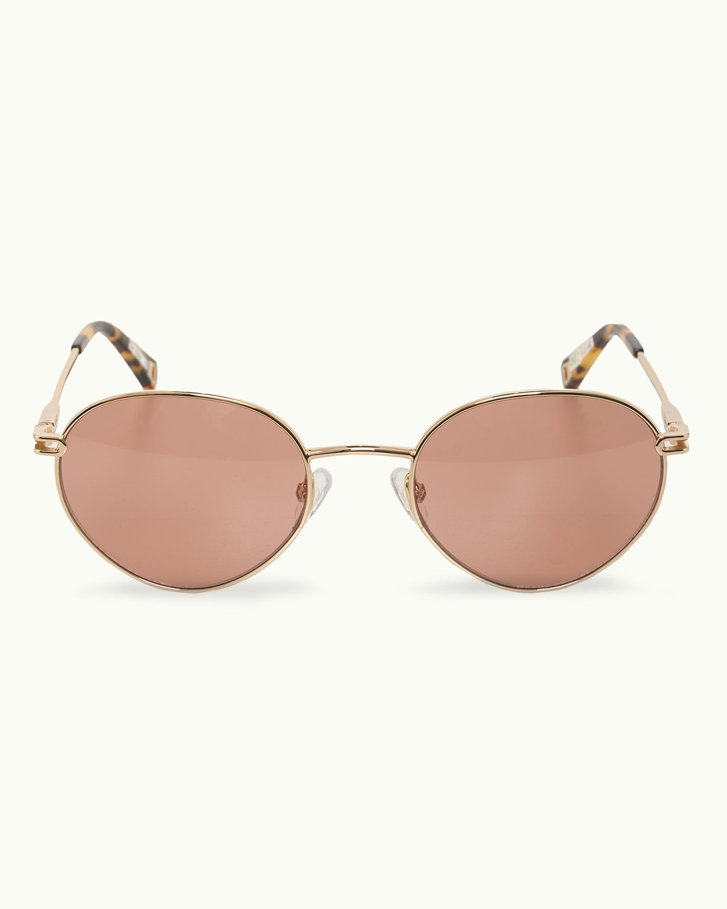 Gold-framed sunglasses with rose gold lenses on a white background