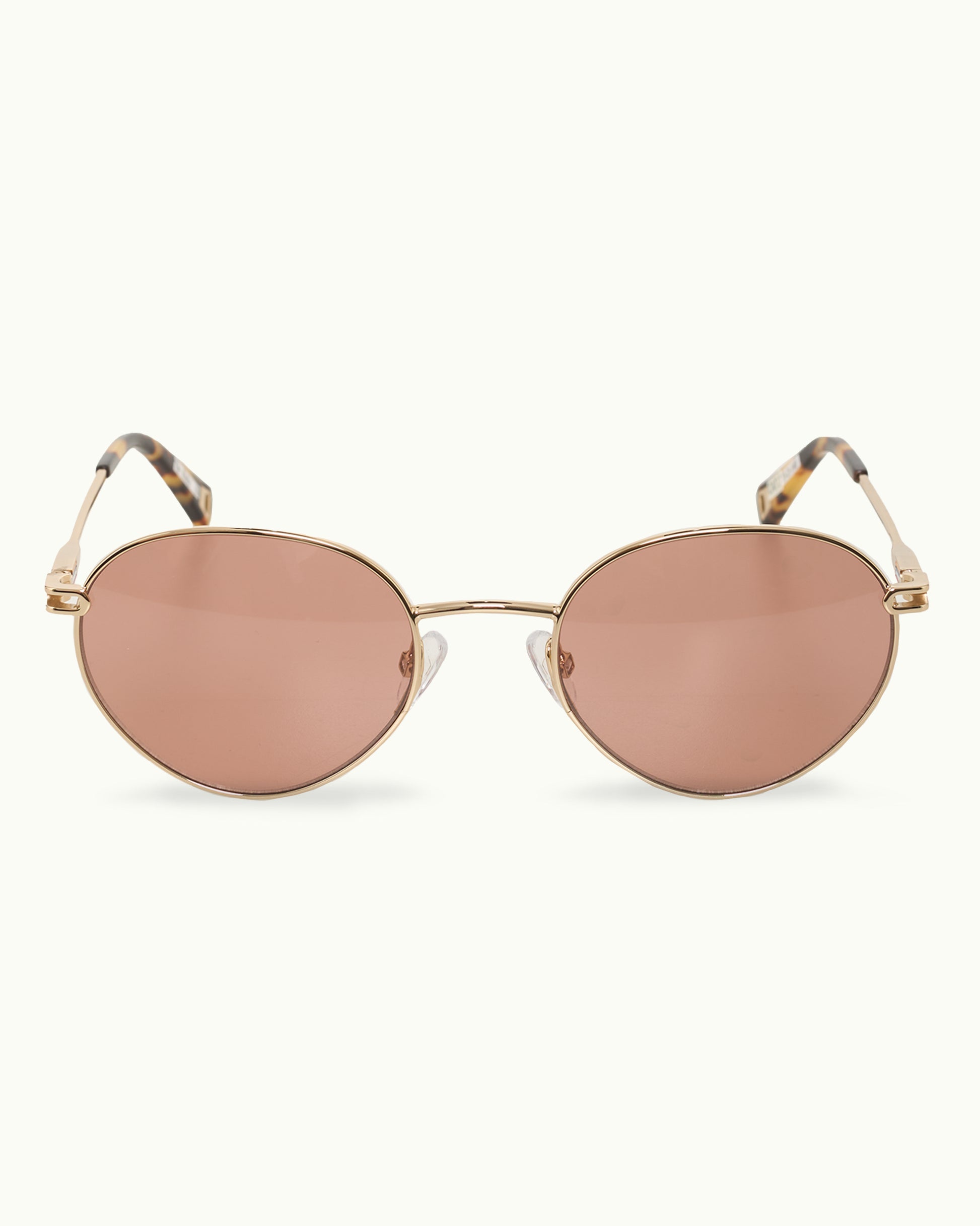 Gold-framed sunglasses with rose gold lenses on a white background