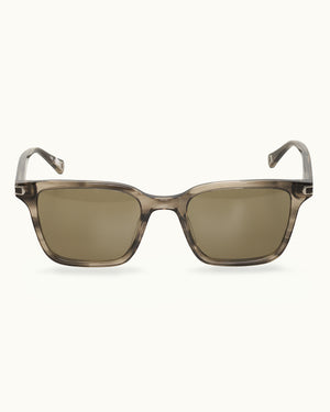 Sunglasses with a brown gradient lens on a white background