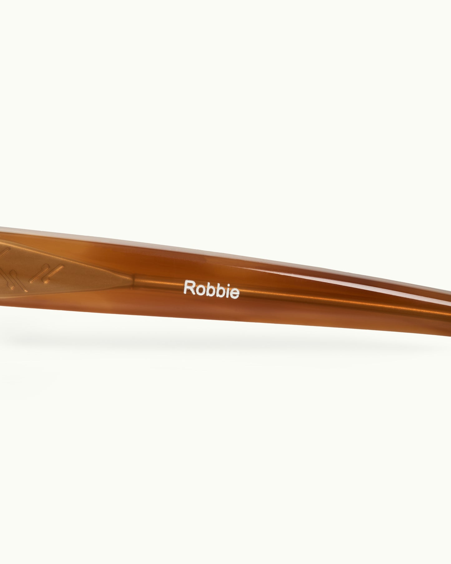 Brown sunglasses with 'Robbie' branding on a white background