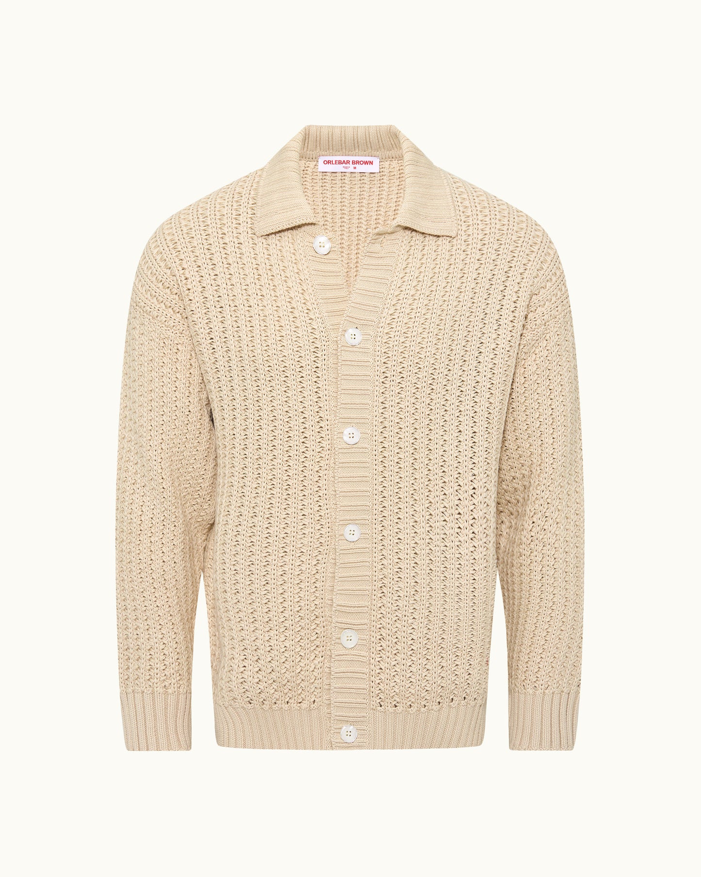 Beige knitted cardigan with button details on a white background