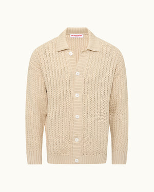 Beige knitted cardigan with button details on a white background