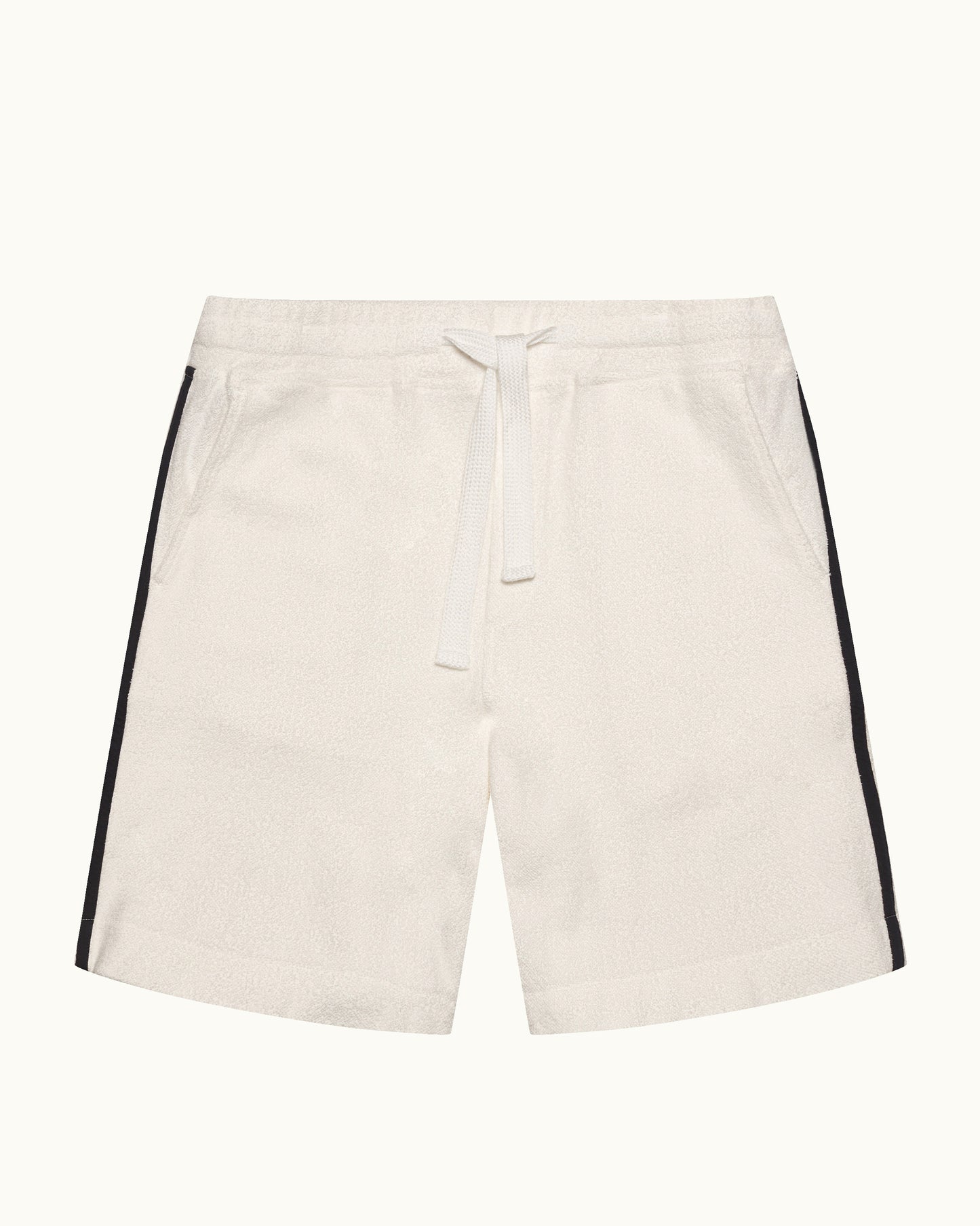 Beige shorts with black side stripes on a white background